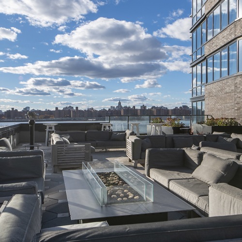 Sun deck with fire pit overlooking the East River