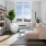 well lit living room with large windows